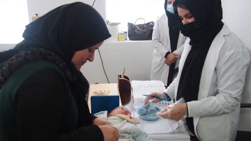 afghan mother and baby doing a pediatric checking